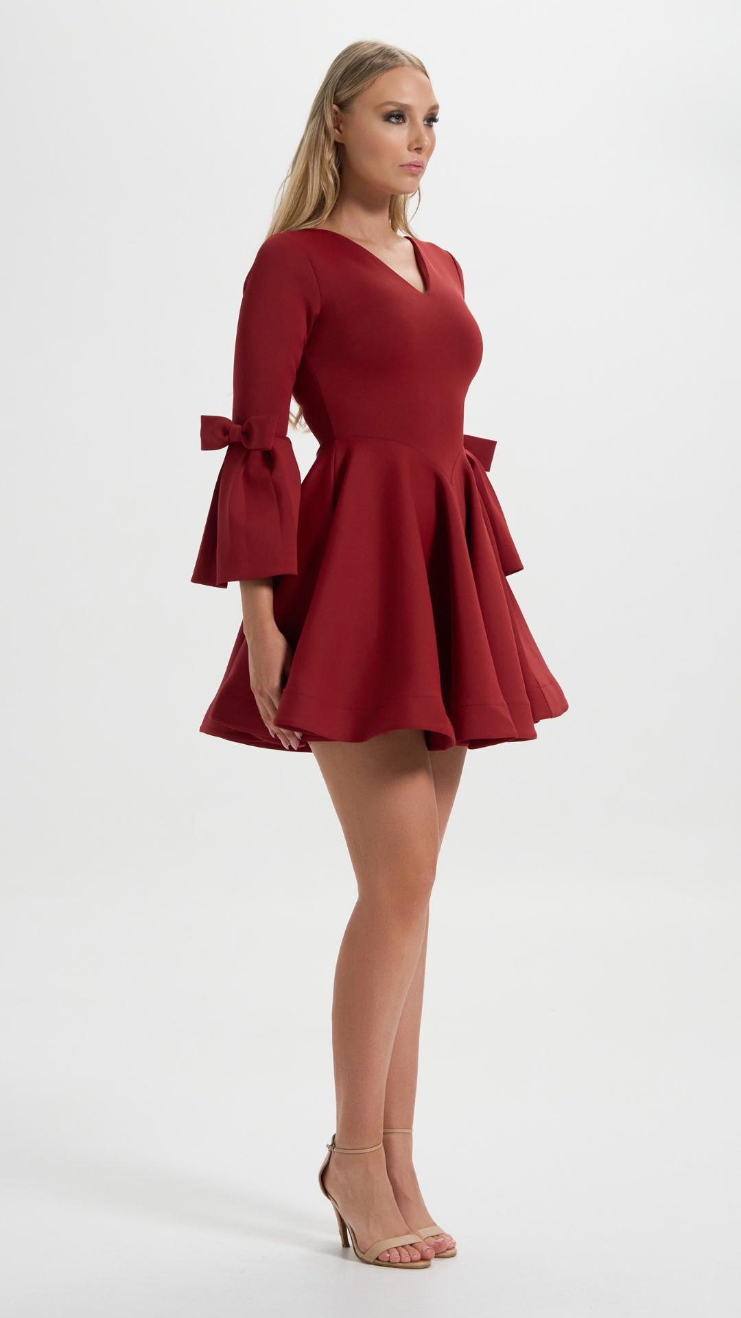Boardroom to Cocktail Hour Dress in Red with the signature ribbon sleeve perfect for your cocktail events (Side Details)