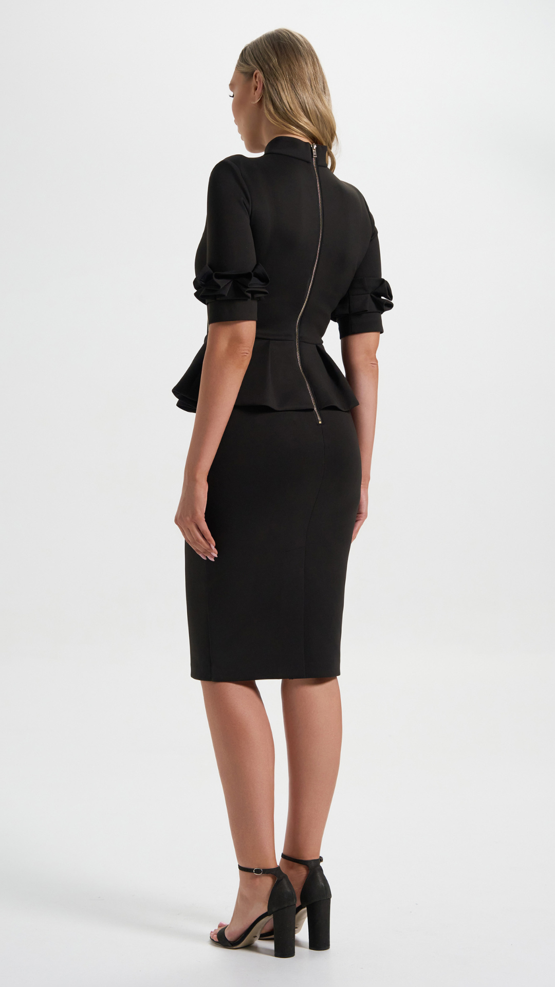 The Commandress in Black with peplum details perfect for your boardroom events (Back Details)